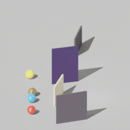Four colored balls moving through a simulated 3D scene